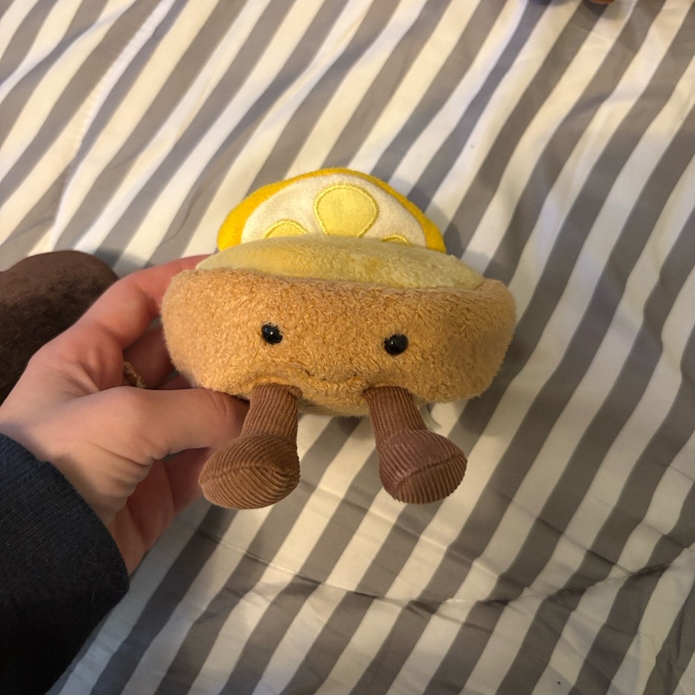 Jellycat Lemon meringue pie yellow and brown.
